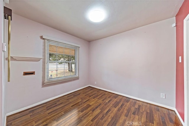 spare room with hardwood / wood-style floors