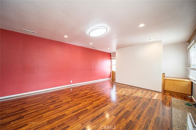 spare room with hardwood / wood-style flooring