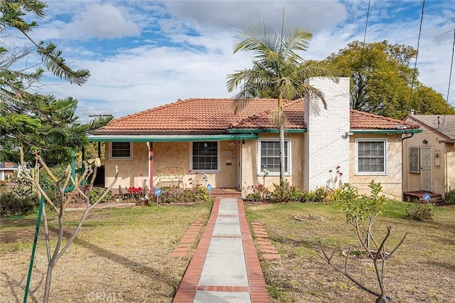 view of front of home with a front lawn and a porch