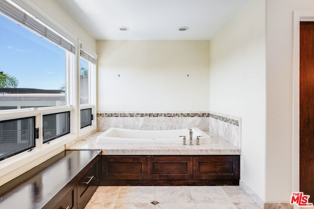 bathroom featuring tile patterned flooring and a bathing tub