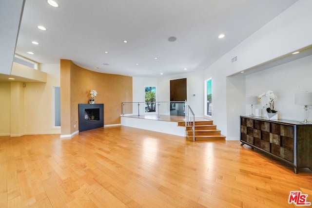 living room with light hardwood / wood-style flooring