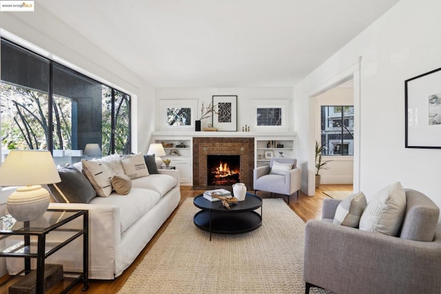 living room featuring a fireplace and hardwood / wood-style floors