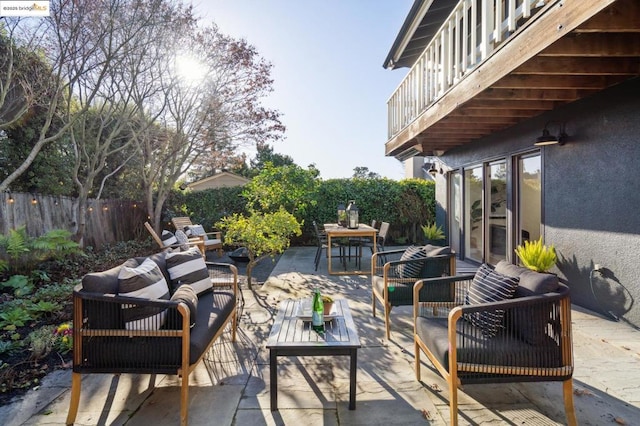 view of patio / terrace featuring a balcony and outdoor lounge area