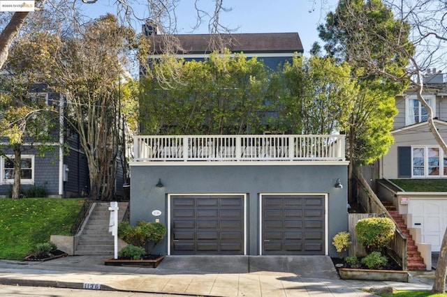 view of front of house with a balcony and a garage