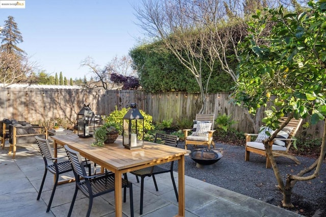 view of patio / terrace featuring a fire pit