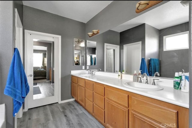 bathroom featuring vanity and hardwood / wood-style floors