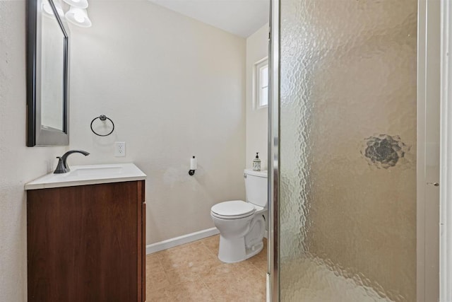 bathroom featuring walk in shower, vanity, and toilet