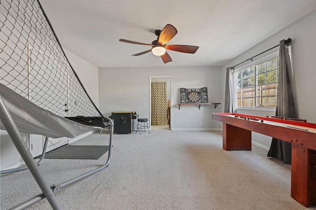 playroom featuring light carpet and ceiling fan