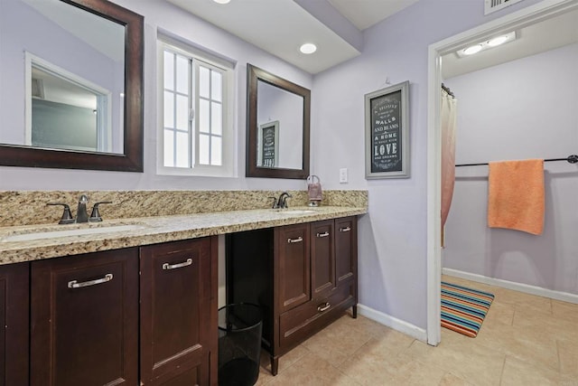 bathroom featuring vanity and tile patterned floors