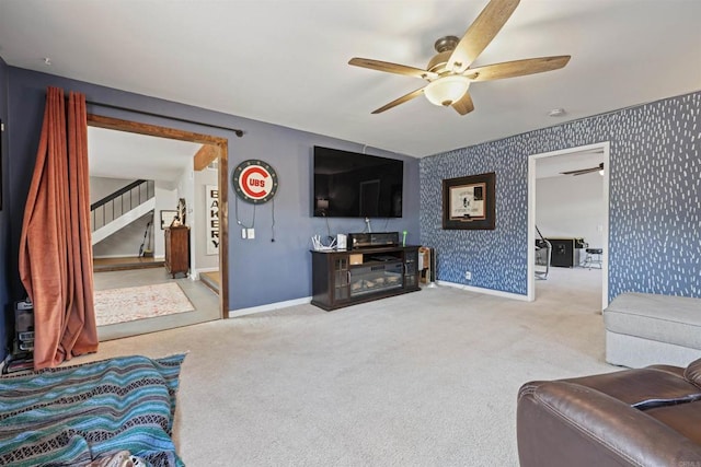 living room with ceiling fan and carpet flooring