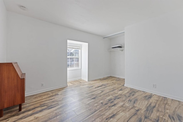 empty room featuring wood-type flooring