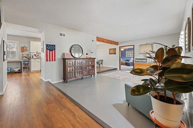 interior space featuring hardwood / wood-style flooring and beverage cooler