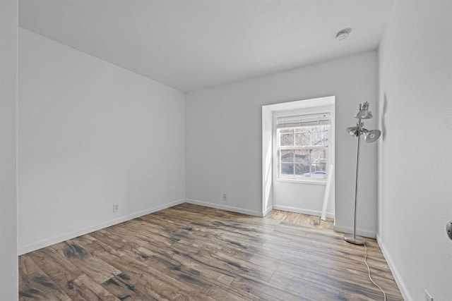 empty room featuring hardwood / wood-style flooring