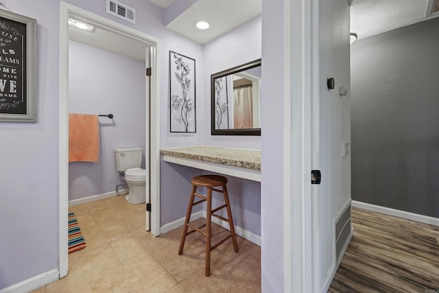 bathroom featuring tile patterned floors and toilet