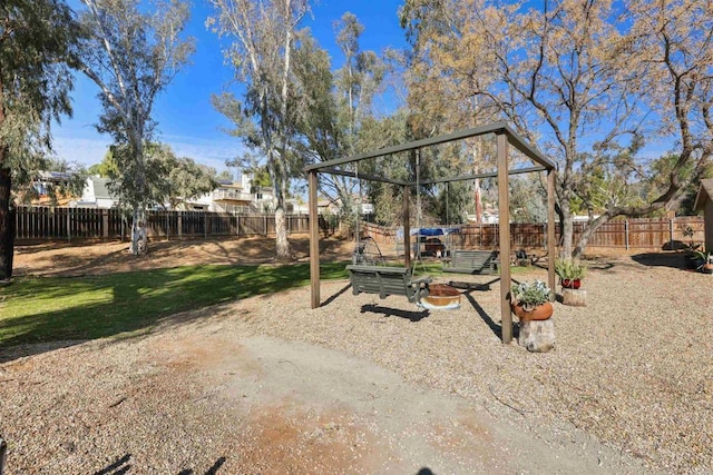 view of yard with a playground and a fenced backyard