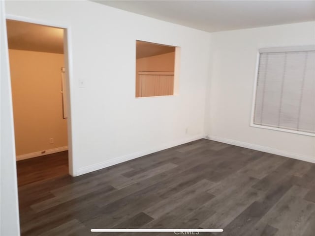 empty room featuring dark hardwood / wood-style floors