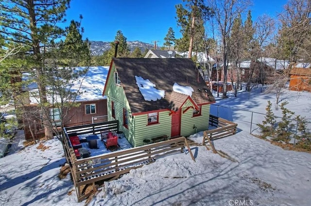 view of snow covered house