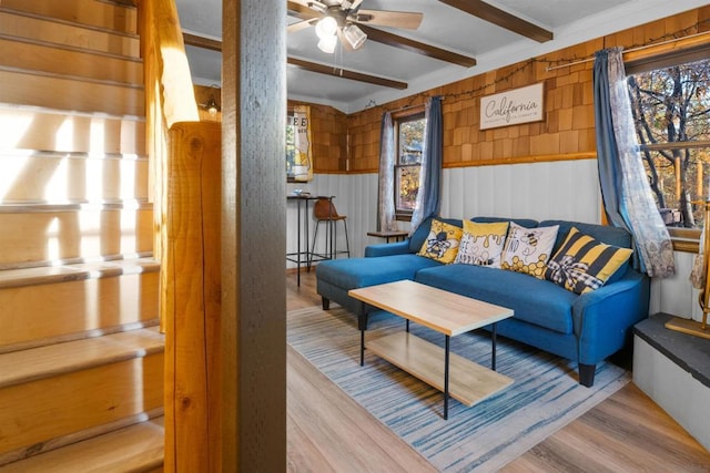 living room with hardwood / wood-style flooring, plenty of natural light, and ceiling fan