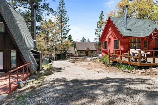 view of side of home with a deck