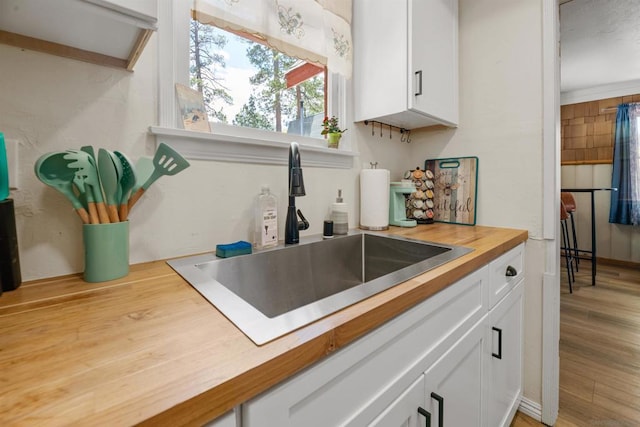 kitchen with sink and white cabinets