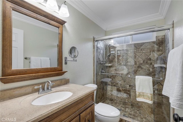 bathroom with an enclosed shower, vanity, crown molding, and toilet