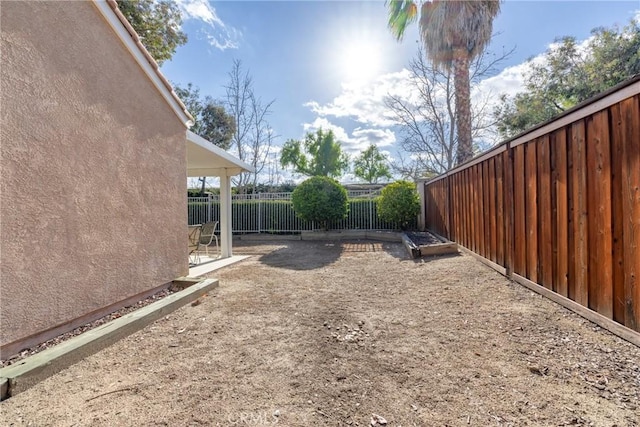 view of yard with a fenced backyard