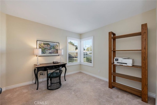 office featuring light colored carpet and baseboards