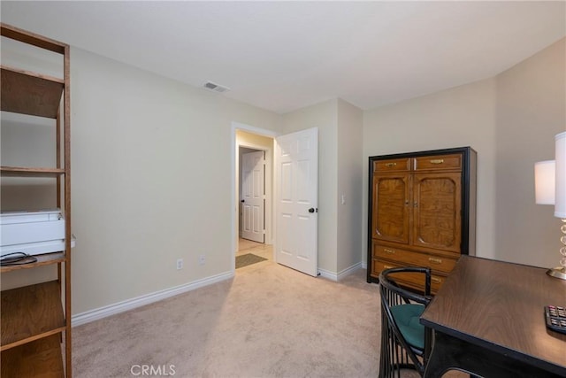 office with light colored carpet, visible vents, and baseboards