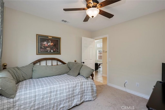 bedroom with light colored carpet and ceiling fan