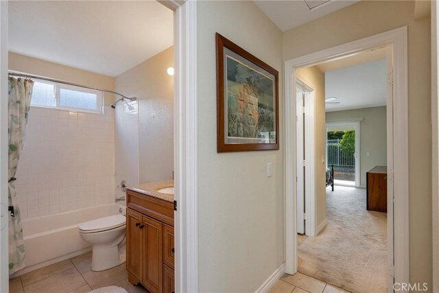 full bathroom with vanity, tile patterned flooring, toilet, and shower / bath combo with shower curtain