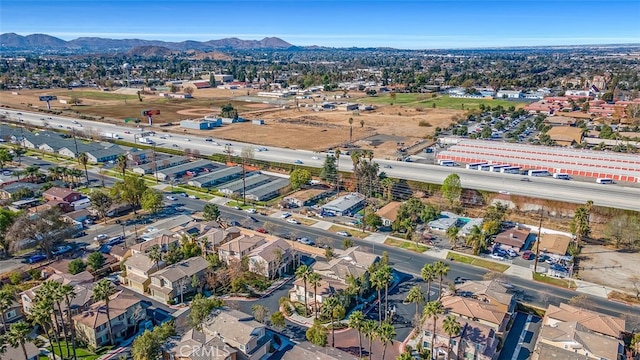 birds eye view of property with a mountain view