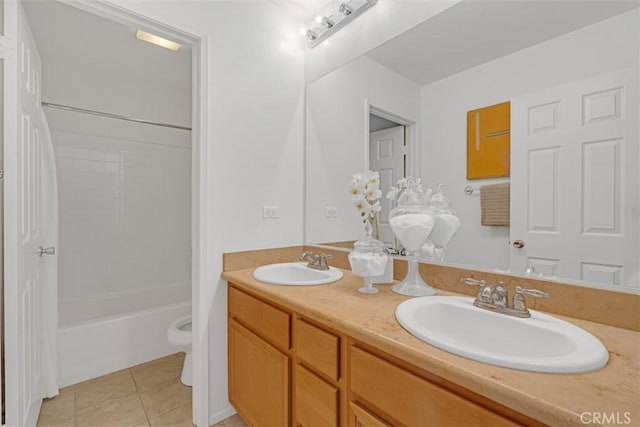 full bathroom featuring vanity, tile patterned floors, washtub / shower combination, and toilet