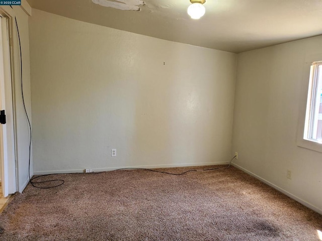 view of carpeted spare room