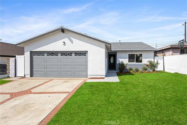 ranch-style home featuring a garage and a front yard