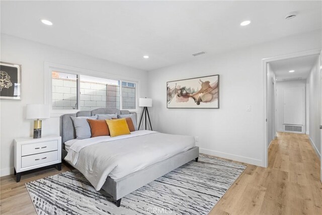 bedroom with light hardwood / wood-style floors