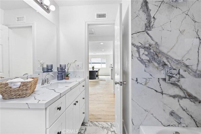 bathroom with vanity and tub / shower combination