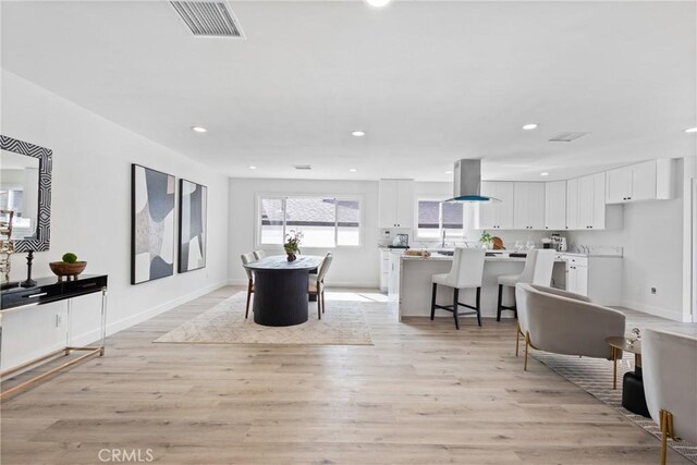 dining space featuring light hardwood / wood-style flooring