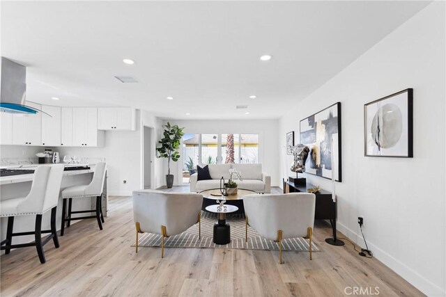 living room with light hardwood / wood-style flooring