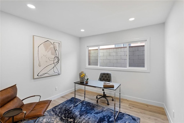 office area with light hardwood / wood-style flooring