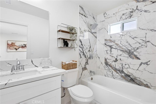 full bathroom featuring vanity, toilet, and tiled shower / bath combo