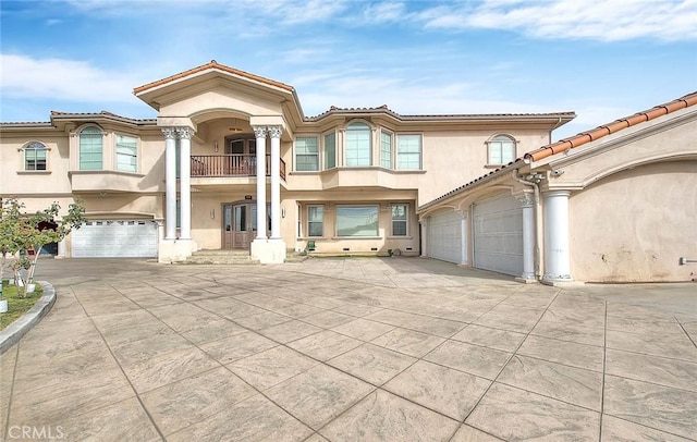 mediterranean / spanish house featuring a garage