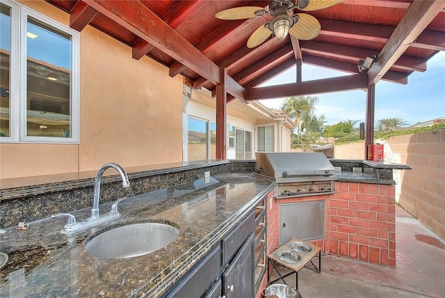 view of patio with sink, a gazebo, area for grilling, ceiling fan, and a grill