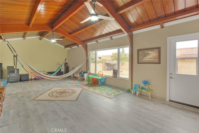 game room featuring wood ceiling, lofted ceiling with beams, ceiling fan, and light wood-type flooring