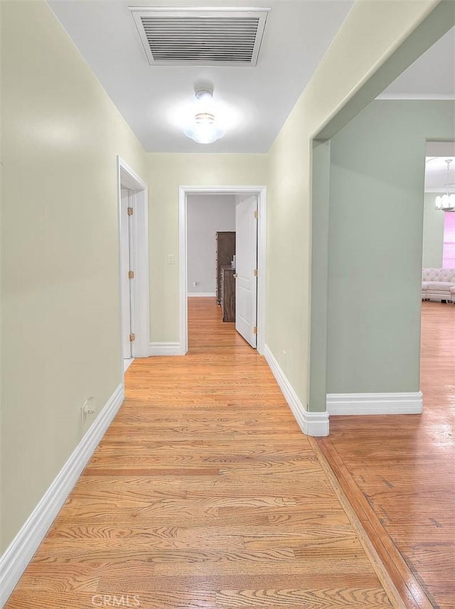 hall with light hardwood / wood-style flooring