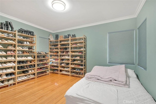 bedroom featuring hardwood / wood-style flooring and ornamental molding