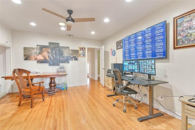 office with light hardwood / wood-style floors and ceiling fan