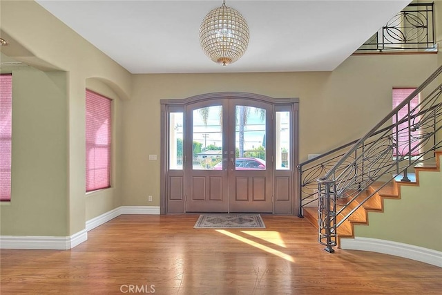 entrance foyer featuring wood-type flooring and french doors