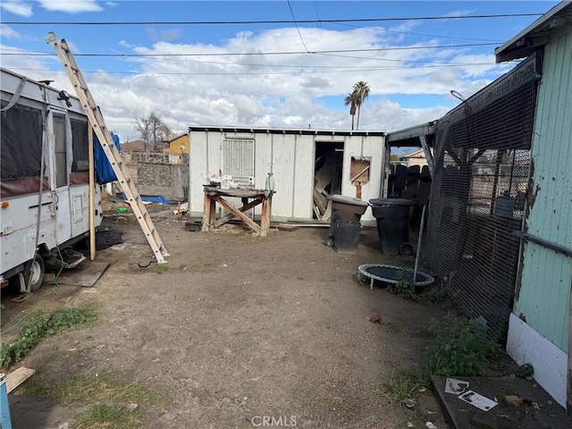 view of outbuilding with a trampoline