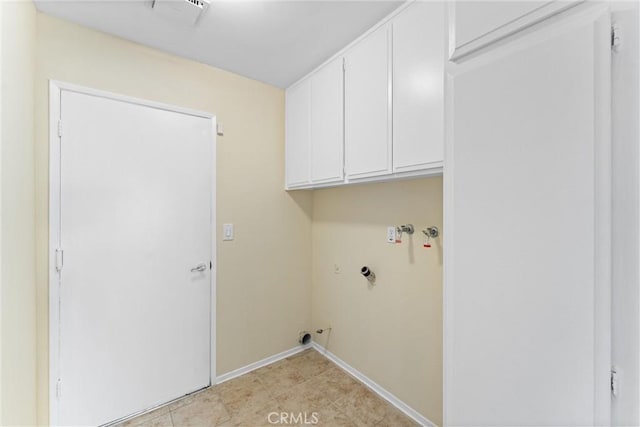 clothes washing area with hookup for a washing machine and cabinets