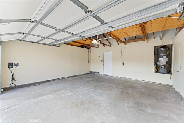 garage featuring a garage door opener and water heater